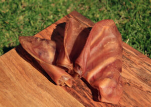 3 pigs ears on a cutting board